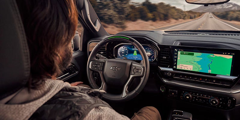 Interior of the 2026 Silverado 1500 featuring leather seating and a large touchscreen display