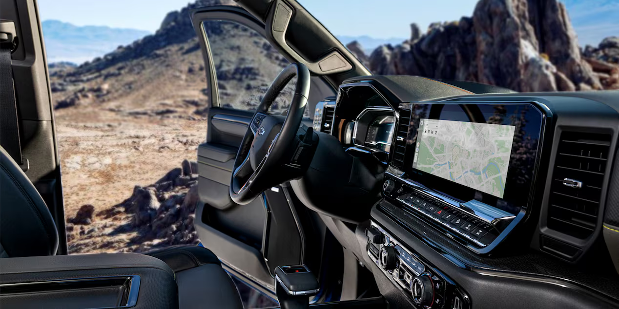 Interior of the 2025 Silverado 1500 featuring leather seating and a large touchscreen display